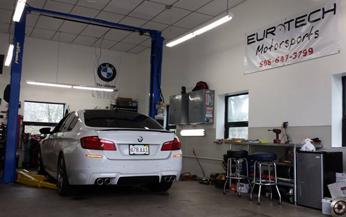 EuroTech shop with BMW 5 Series in garage